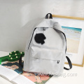 Fashion polyester customize Logo trend high school bag simple color travel backpacks pendant bags